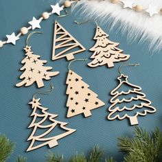 wooden christmas tree decorations on a blue background