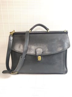 Authentic COACH Black Genuine Leather flap briefcase cross body shoulder bag messenger vintage Size: Large Condition: excellent vintage pre-owned, minor wear, nice and clean Classic Briefcase With Hasp Closure, Classic Business Satchel With Hasp Closure, Classic Briefcase With Hasp Closure For Travel, Classic Travel Briefcase With Hasp Closure, Classic Business Shoulder Bag With Hasp Closure, Classic Flap Shoulder Bag For School, Classic Business Briefcase With Hasp Closure, Vintage Rectangular Briefcase For Work, Vintage Crossbody Work Bags