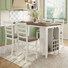 a kitchen table with two stools next to it