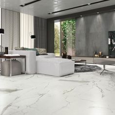 a modern living room with marble floors and white furniture