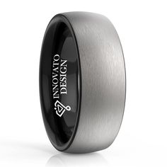 a black and silver wedding band with the words detroit on it