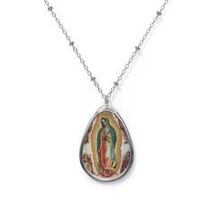 Add a custom touch to what you're wearing with this necklace showing the beautiful painting of Our Lady of Guadalupe painted by Miguel Cabrera in 1750 The pendant and its chain are made with robust brass material for dazzling looks that are long-lasting. The print panel is made with aluminum while the pendant itself comes in a unique shape of an ellipse. .: Brass pendant and necklace chain .: Ellipse-shaped pendant .: White aluminum print surface .: Lobster clasp closure Silver Our Lady Of Guadalupe Necklace, Oval Our Lady Of Guadalupe Jewelry Gift, Spiritual Our Lady Of Guadalupe Jewelry Gift, Oval Our Lady Of Guadalupe Necklace Gift, Oval Our Lady Of Guadalupe Necklace For Gift, Spiritual Oval Our Lady Of Guadalupe Necklace, Spiritual Oval Necklace Featuring Our Lady Of Guadalupe, Catholic Confirmation, Virgin Of Guadalupe