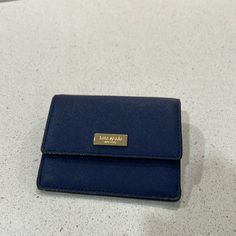 Brand New Never Used Navy Blue Kate Spade New York Wallet. Key Chain Attached Inside, 6 Credit Card Slots With Extra Room On Inside Dimensions: 4.5 Inches Long, 3.8 Inches High Formal Blue Bags With Card Slots, Blue Bags With Rfid Blocking For Daily Use, Elegant Blue Wallets With Interior Card Slots, Compact Blue Wallets For Daily Use, Chic Blue Rectangular Wallet, Blue Rectangular Rfid Blocking Bag, Blue Rfid Blocking Bags, Kate Spade Blue Wallet With Card Slots, Kate Spade Blue Travel Wallet