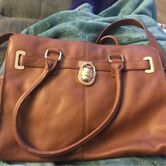 Gorgeous Caramel Colored Heavy Thick Pebble Leather Bag. Great For Any Occasion. Had Tag And Can’t Find Now, Never Used. Sturdy Leather And Very Stylish With Gold Chain Attached To Long Leather Strap And Lock. Also Has Short Handle. Beautiful Craftsmanship, Clean Inside Except For A Single Drop Light Clear Stain Near Top. Not Sure What It Is Maybe Just Water? Anyway Never Used. Scratches Near Logo On Lock From Being Stored With Other Purse When I Moved. Otherwise Very Very Clean Never Used. To H Cognac Bag With Metal Hardware For Daily Use, Brown Satchel Shoulder Bag With Silver-tone Hardware, Cognac Bag With Metal Hardware For Everyday Use, Cognac Satchel Bag With Metal Hardware, Cognac Bags With Metal Hardware For Everyday Use, Cognac Shoulder Bag With Metal Hardware For Travel, Classic Calvin Klein Shoulder Bag For Daily Use, Brown Double Handle Bag With Metal Hardware, Brown Satchel With Silver-tone Hardware For Travel