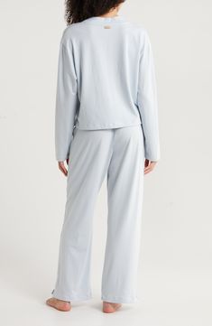 A wonderfully soft blend of modal and organic cotton gets a touch of added stretch in pajamas you'll want to wear whenever you're at home. Top has front button closure; V-neck; long sleeves; chest patch pocket Pants have elastic waist 57% Tencel® modal, 38% organic cotton, 5% spandex Tencel modal is a sustainably produced fiber made with closed-loop processing and is certified with the EU Ecolabel as having a low environmental impact throughout the entire lifecycle Machine wash, tumble dry Impor Soft Cotton Sleepwear For Pajama Party, Super Soft Long Sleeve Sleepwear For Loungewear, Super Soft Comfortable Sleepwear For Bedtime, Soft Touch Relaxed Fit Sleepwear For Relaxation, Relaxed Fit Sleepwear With Soft Touch For Relaxation, Comfortable Soft Relaxed Fit Sleepwear, Comfy Cotton Sleepwear For Relaxation, Soft Cotton Sleepwear, Soft Comfortable Sleepwear For Relaxation