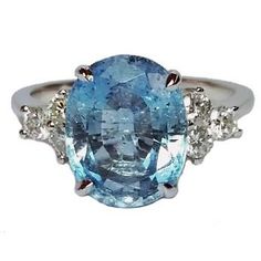 an oval cut blue topazte and diamond ring