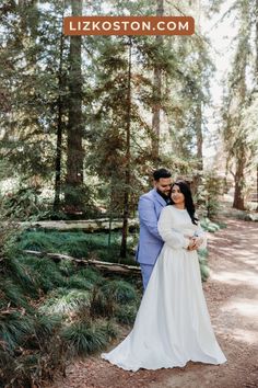 a bride and groom pose for their wedding photo in the woods at lizkoston com