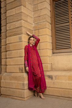 DETAILS Short, round hemmed shirt in silk charmeuse. Contrast hand-embellished kamdani collar, with back necktie. Gathered sleeves with a contrast cuff, hand-embellished with kamdani. Wide, matching shalwar, finished with gota work. Cotton net, contrasting dupatta, hand-embroidered with kamdani and finished with crochet lace edge. COLOR Red / Green / Cream / Shocking Pink SIZE Custom Order - A measurement guide will be sent upon order. Model is 5'7 MATERIAL Shirt - Silk CharmeuseTrousers - Silk Red Silk Long Sleeve Kurta, Red Silk Kurta For Eid, Gota Work, Crochet Lace Edging, Shocking Pink, Gathered Sleeves, Silk Charmeuse, Green Cream, Lace Edging