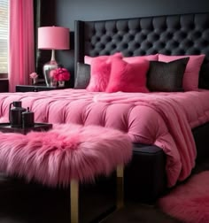 a bedroom with pink bedding, black walls and fur rugs on the floor