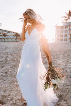 Turn heads in our gorgeous white 'True Romance' maxi dress featuring lightweight layered material with a beautifully pleated under layer and a dainty tulle top layer, a deep v-cut neckline, adjustable spaghetti straps that cross a deep open back, a fitted waistline, and a flowy skirt silhouette that cascades into an uneven floor-length hemline! Measurements S : Bust 28", Hip 36", Length 56", Waist 27". M : Bust 30", Hip 38", Length 57", Waist 29". L : Bust 32", Hip 40", Length 58", Waist 31". Pleated Tulle, Tulle Maxi Dress, Tulle Top, True Romance, Impressions Online Boutique, Uneven Floor, Flowy Skirt, Model Fits, V Cut