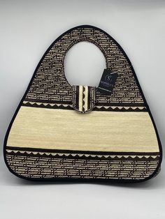 These beautiful handbags are made from Cana Flecha which is an indigenous palm fiber found in the northern territory of Colombia. They are beautifully hand crafted by the people from the Zenu tribes in Colombia. These handbags are colorful with vibrant colors, which is a pure reflection on the region and the warmness of these master artisans that work in this industry every day. Natural Woven Satchel Shoulder Bag, Top Handle Woven Jute Shoulder Bag, Woven Jute Shoulder Bag With Top Handle, Jute Woven Top Handle Shoulder Bag, Top Handle Jute Shoulder Bag With Woven Details, Traditional Handwoven Satchel For Everyday Use, Traditional Handheld Bag For Everyday Use, Traditional Woven Satchel For Everyday Use, Handwoven Natural Satchel For Everyday Use