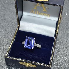 Emerald-Cut Tanzanite & Diamond Ring 14k White Gold (5.54ct)- Allurez.com  #gemstonerings #allurez #Tanzanite #Emeraldcut Emerald Cut Tanzanite Ring, Formal Tanzanite Diamond Ring With Diamond Accents, Formal Tanzanite Diamond Ring With Accents, Gia Certified Purple Diamond Jewelry, Tanzanite Radiant Cut Ring For Anniversary, Radiant Cut Tanzanite Ring For Anniversary, Radiant Cut Tanzanite Ring For Formal Occasions, Formal Purple Sapphire Jewelry, Radiant Cut Tanzanite Jewelry With Prong Setting