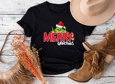 Merry Grinchmas T-Shirt, Merry Christmas Shirt, Grinchmas Shirt, Grinch Christmas Shirt, Christmas Grinch T-Shirt, Christmas Family T-Shirt ⭐⭐Tapancustomtees⭐⭐ ⭐ US customers get free shipping on any purchases totaling $35 or more. ⭐ For all colors, we utilize white vinyl; however, for white, peach, and heather athletic grey shirts, we use black vinyl. Please specify whether you want gold or black vinyl in the personalization part. ⭐8-ounce, 50/50 cotton/poly sweatshirts and hoodies. T-shirts: 100% combed ring spun cotton, 4.3-ounce.  ⭐ Return policy: Unless there is a defo on the product, we are unable to accept returns since it is print on demand type business. ⭐ Shipping: Ground Advantage delivery within 2-5 working days. You need upgrade the delivery choice if you want express shipping Merry Grinchmas Shirt Vinyl, Grinch Christmas Shirts United Monograms, Grinch Christmas Shirt, Grinch T Shirt, Merry Grinchmas, Christmas Grinch, Merry Christmas Shirts, Grinch Christmas, Sweatshirts And Hoodies