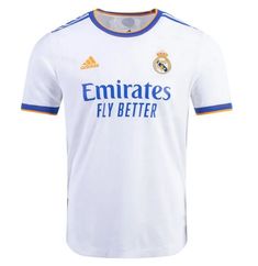 the real madrid jersey is white and has blue trimmings on the chest, while it