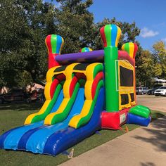 an inflatable bounce house is on the lawn