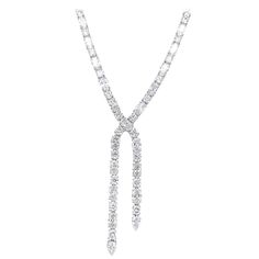 Exquisite diamond bow motif drop necklace, by Alexander Beverly Hills. 29.92 carats total diamond weight. 50 oval brilliant diamonds, 20.25 carats. 52 round brilliant diamonds, 9.67 carats. Approximately F/G color and VS2/SI1 clarity. Prong set in 18k white gold, 31.93 grams, and 16.5 inches. Accommodated with an up-to-date digital appraisal by a GIA G.G. once purchased, upon request. Please contact us with any questions. Item Number NS1780 Diamond Bows, Tennis Necklace, Diamond Drops, Drop Necklace, Brilliant Diamond, Item Number, Round Brilliant, Round Diamond, Beverly Hills