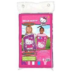 the hello kitty bedding set is pink and has two girls standing next to it