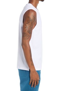 A soft and stretchy blend yields all-around performance comfort in a versatile, American-made T-shirt in a laid-back sleeveless cut. 28" length (size Medium) Crewneck Sleeveless 50% polyester, 25% cotton, 25% rayon or 52% cotton, 48% polyester Machine wash, tumble dry Imported Athleisure Cotton Tank T-shirt, Cotton Tank T-shirt For Athleisure, White Cotton Muscle Tee Athleisure, Cotton Sleeveless Athleisure Muscle Tee, Cotton Sleeveless Muscle Tee For Athleisure, Cotton Tank Tops Athleisure Style, Relaxed Fit Sleeveless Moisture-wicking Tops, Relaxed Fit Sleeveless Tops With Moisture-wicking, Cotton Sleeveless Muscle Tee For Sports