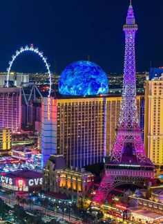 the eiffel tower lit up at night in las vegas