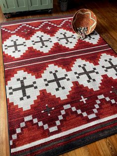 a red and black area rug on the floor