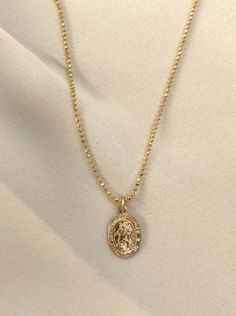 Keep this lucky charm close! Saint Christopher is a symbol for safe travel. Gold plated 16" chain, 2" extender. Gently rubbing the surface of your gold plated jewelry using a soft jewelry cloth helps restore shine. You may clean it with warm, soapy water. Gold Plated Tarnish Resistant Necklace For Good Luck, Tarnish Resistant Gold Plated Necklace For Good Luck, Gold Medallion Charm Necklace For Good Luck, Gold Amulet Charm Necklace Tarnish Resistant, Gold Tarnish Resistant Amulet Charm Necklace, Gold Tarnish-resistant Charm Necklace For Good Luck, Gold Tarnish-resistant Amulet Charm Necklace, Gold Plated Oval Pendant Charm Necklace, Hypoallergenic Gold Pendant Necklace