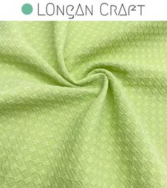 a green fabric with the words longan craft on it