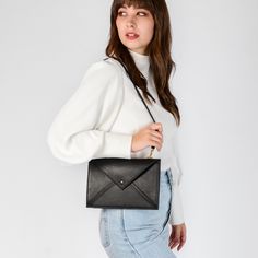 Minimalist Envelope Bag For Everyday, Minimalist Everyday Envelope Bag, Chic Everyday Envelope Clutch, Classic Everyday Crossbody Clutch, Minimalist Envelope Clutch For Everyday Use, Modern Envelope Clutch For Everyday, Envelope Shoulder Bag With Magnetic Closure, Modern Envelope Shoulder Bag For Everyday, Envelope Shoulder Bag With Magnetic Closure For Everyday