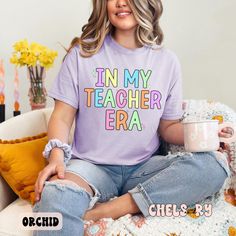 School is back and this tee will make the cutest fit with a part of jeans or cute flowy skirt! Snag this comfy tee if you're a teacher of if you are looking for the perfect teacher appreciation gift! TEE DETAILS: Chels & Ry Original Design - made in house with top quality prints to ensure longevity of the design Comfort Colors shirt - Unisex fit, true to size. If you like a more relaxed fit, I recommend sizing up one or two. PRE-ORDER CLOSES JULY 5TH AND WILL SHIP IN 5-7 BUSINESS DAYS FROM THERE. I AM MAKING THESE TO ORDER! CARE INSTRUCTIONS: Turn inside out and wash on cold gentle cycle. Hang dry is best, but they can be put in the dryer on LOW heat! Do not iron on the design. Cute Flowy Skirts, July 5th, My Teacher, Comfort Colors Shirt, Teacher Appreciation Gift, Cute Fit, Flowy Skirt, Teacher Appreciation Gifts, Comfy Tees