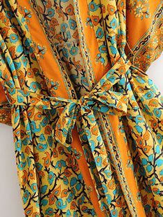 This beautiful contrast kimono contains a vibrant touch of colors mainly orange with a mixture of blue and beige. The fabric is extremely breathable which feels fine and luxurious soft next to your skin. Beautifully drapes around your body. Material: Cotton Viscose Floral Bohemian Print Belted Kimono Broad sleeves with an armpit gap opening Very soft. Comfy & Breathable Size Details: One size: S-M-L Shoulder: 60 Bust & Hips: 120 Sleeves: 36 Length: 136 Model Measurements:Bust: 88cm. Waist: 68cm. Shoulder: 38cm. Height: 67.2inch Belt Kimono, Kimono Floral, Kimono Duster, Bohemian Print, Cotton Viscose, Long Length, Model Measurements, Color Patterns, Orange Color