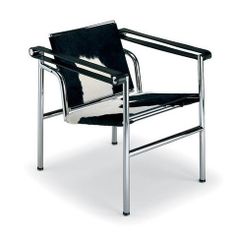 a black and white chair sitting on top of a metal frame