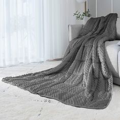 a couch with a blanket on top of it