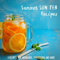 a mason jar filled with lemonade and mint tea on top of a blue table