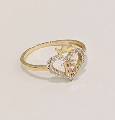 14k Real Solid 2 Tone Gold 15 Anos Quinceanera Heart Corazon Anillo Ring White CZ Stone RG3403 Material Type:  14k Gold Average Weight:    1.5 g Gold Heart Ring For Valentine's Day Birthday, Yellow Gold Rings For Birthday Or Valentine's Day, Personalized Yellow Gold Jewelry For Sweet 16, Gold Heart-shaped Ring For Birthday, Gold Rings For Birthday - Fine Jewelry, Fine Jewelry Gold Rings For Birthday, Gold Fine Jewelry Rings For Birthday, Elegant Gold Jewelry For Sweet 16, Gold Heart-shaped Initial Ring For Anniversary