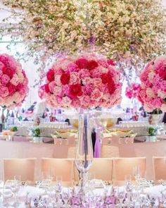 the centerpieces are filled with pink flowers