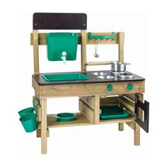 a wooden play kitchen with green pots and pans