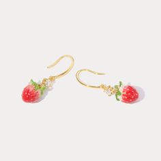 Indulge in the sweetness of these luscious strawberry earrings. Featuring a delicate enamel finish and shimmering cubic zirconia, these cheerful earrings brighten up your look with a touch of nature-inspired style. Perfect for adding a pop of freshness and fashion to your summer vibes! DETAILS Plating: 18K Gold Materials: 18K Gold on Brass, Enamel, Cubic Zirconia Size: 1.39 "*0.39"(3.4c m*1cm) Weight: 6.4g Sweet Strawberry Print Jewelry As Gift, Gold Earrings With Fruit Design For Gift, Cute Fruit Design Earrings, Sweet Gold Dangle Jewelry, Sweet Gold Earrings For Gift, Strawberry Earrings, Fruit Necklace, Everyday Wear Jewelry, Astrology Jewelry