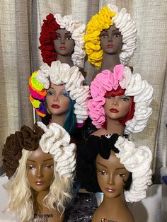 several wigs are stacked on top of each other