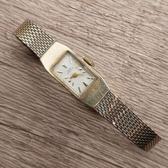 Vintage ladies 10K gold filled watch from luxury Swiss watch maker Girard Perregaux circa 1960s. Very rare elegant ladies wrist watch. Dial with gold hands and gold hour markers. All the hours are marked by ticks. Movement Jewels: 17. Swiss made. Case Back Signed: 10K G.F. (Gold Filled) - G/P. Case Serial No: B2268. Band: Kestenmade 1/20 10K GF USA, PAT. No 3,319,308. Measures: 8 mm x 12 mm (dial) x 6 mm (thickness). Width: 12 mm with crown. Weight: 0.6 oz. Vintage Girard Perregaux watch is in good pre-owned condition. Has a little scratch on the crystal. Winds, sets and runs. It's a nice addition to any watch collection. Vintage Gold Watch Swisswatchexpo, Tiny Watch, Lady Watches, Ladies Wrist Watch, Vintage Watches Women, Girard Perregaux, Swiss Watch, Watch Dial, Elegant Ladies