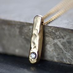 Solitaire Diamond & Recycled Solid 9ct Yellow Gold Bar Column Slider Pendant Necklace, Handmade Hammered Gold Pendant, gift, bride, wedding *These pendants are hand-forged & MADE TO ORDER, please allow up to 15 working days from order for despatch* A minimalist, handmade necklace, made from solid 9ct gold, featuring a single, bright white, brilliant diamond. The 9ct gold pendant has been formed by melting & smelting down recycled 9ct gold in the workshop, hammered & forged into an organic shaped Hammered 14k Gold Wedding Necklace, 14k Gold Hammered Necklace For Wedding, Wedding Hammered 14k Gold Necklaces, Hammered Pendant Jewelry For Wedding, Hammered Yellow Gold Wedding Necklace, Wedding Pendant Necklace With Hammered Detail, Memorial Pendant, Diamond Pendants, Detailed Necklace