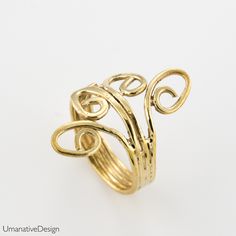 Trendy, beautiful, boho-chic toe ring / pinky ring / knuckle ring (knuckle rings are also called midi-ring or an above the knuckle ring). This is an open ring, so it is adjustable. Material: Brass One size fits all. Width: 0.8Inch / 20mm (widest part),0.158Inch / 4 mm around. *Nickel- free For more toe & knuckle rings- https://www.etsy.com/shop/Umanativedesign?section_id=17028060&ref=shopsection_leftnav_7 We offer a range of septum rings, for pierced and non- pierced noses, made of diffe Adjustable Gold Dainty Toe Rings, Adjustable Dainty Gold Toe Rings, Unique Hand Forged Toe Ring, Bohemian Brass Stackable Rings, Unique Brass Toe Ring Jewelry, Bohemian Open Ring Toe Rings As Gift, Brass Metal Stackable Toe Rings, Bohemian Adjustable Midi Rings For Wedding, Handmade Gold Open Toe Rings