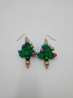 A fun set of Christmas shaped earrings perfect as a stocking stuffer! ⚬ Free shipping on all orders $35 or above ⚬ Each piece is handmade ⚬ Made in the USA. ⚬ More in our shop: https://www.etsy.com/shop/BellaLilahJewelry QUESTIONS? Please feel free to message me anytime! I'd love to hear it and I'm ready to answer all of your questions! Thank you for visiting Bella Lilah. Tree Earrings, Christmas Tree Earrings, Jewelry Christmas, Earring Tree, Christmas Gift Jewelry, Christmas Jewelry, Stocking Stuffer, Handmade Christmas, Earrings Handmade