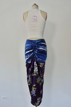 One of a Kind Size Medium Elastic waistband Elastic ruching Cotton stretch fabric Model is 5’8, 32A Bust, Waist 26, Hips 38.5 Sizing Measurements in Inches Below Waist 26-32”, Hips 38-50”, Length 35” Up-cycled from a shirt and a kimono *Hand Wash Blue Stretch Bottoms With Ruched Sides, Bohemian Stretch Bottoms With Gathered Skirt, Spring Draped Bottoms With Ruched Sides, Fitted Bottoms With Gathered Waist For Spring, Ruched Fitted Draped Maxi Skirt, Fitted Ruched Draped Maxi Skirt, Fitted Maxi Skirt With Ruched Sides For Spring, Blue Stretch Gathered Skirt, Ruched High Waist Maxi Skirt