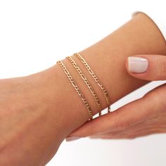 Our new simple and dainty Figaro chain bracelets, as always made in 14k solid gold. You can wear this bracelet with a free mind without worrying about water, perfume, or conditioner contact since real gold never tarnishes.★ Features of the Bracelet (this listing is for a single bracelet only)• Gold Kt: 14K Solid Gold (all pieces are stamped for authenticity)• Available Gold Color: Yellow Gold• Chain Width: 2.5 mm Dainty 14k Gold Jubilee Chain Bracelet, Dainty Yellow Gold Link Bracelets, Dainty 14k Gold Link Bracelet, Everyday 14k Gold Delicate Chain Bracelet, Dainty Yellow Gold Bracelet, Dainty Yellow Gold Diamond Bracelet, Dainty Yellow Gold Chain Bracelet, Delicate 14k Yellow Gold Chain Bracelet, Dainty 14k Gold Link Chain Bracelet