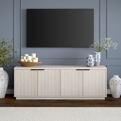 On-trend texture and design combine in this transitional TV stand. With a wood grain finish and textured fluting, this piece is sure to be a statement in your living room, den, or game room. The plinth base gives an illusion of a seamless transition from your floor, while the rounded front corners create a softer modern shape. The console features 4 fully enclosed doors with 4 inner shelves, allowing for ample storage for your devices, games, books, and more. Color: Alder White | Latitude Run® S Tv Console Decorating, Transitional Tv Stand, Tv Stand Decor Living Room, Tv Stand Decor, White Tv Stands, Dark Wood Floors, Living Room Tv Stand, Coastal Living Room, Grey Flooring