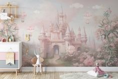 a child's room decorated in pink and white with a castle mural on the wall