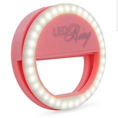 the light up ring is pink and has white lights on it's sides, which are