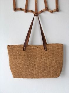 Elegant Brown Beach Bag For Vacation, Elegant Beach Bag With Leather Handles For Vacation, Luxury Beach Bag With Leather Handles, Elegant Travel Beach Bag, Elegant Brown Beach Bag For Everyday Use, Elegant Beach Bag With Handles For Vacation, Elegant Beach Bag With Braided Handles For Travel, Natural Color Crochet Travel Bag With Leather Handles, Natural Crochet Bag With Leather Handles For Travel