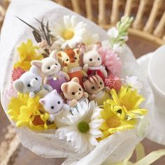 a bunch of small toy animals in a bouquet