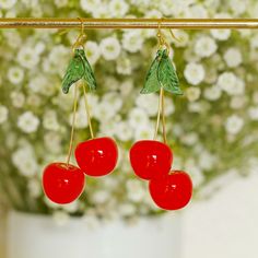 Beautiful cherry earrings with resin cherry and leaf charms and brass earring hooks. Perfect for party, beach and boho wear. Drop length =  70mm  7cm   2.75 inches Charm width  30mm   3cm    1.2 inches Processing time is 24-48 hrs Mon-Fri. 24-72 hrs for weekend and holiday orders due to post office opening times. Summer Gift Cherry Earrings, Cherry Colored Earrings For Summer Party, Cherry Color Earrings For Summer Party, Retro Red Earrings For Summer, Boho Wear, Brass Earring, Earrings Leaf, Cherry Earrings, Fruit Earrings