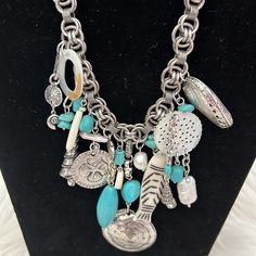 Awesome Charms . Silver , Turquoise And Mother Of Pearl Blue Metal Charm Necklace With Lobster Clasp, Blue Metal Necklace With Charms, Blue Bohemian Necklace With Silver Chain, Bohemian Blue Jewelry With Silver Chain, Bohemian Blue Necklace With Silver Chain, Nickel-free Blue Metal Charm Necklaces, Turquoise Bohemian Charm Necklaces, Turquoise Dangle Nickel-free Necklace, Turquoise Dangle Necklace Nickel Free